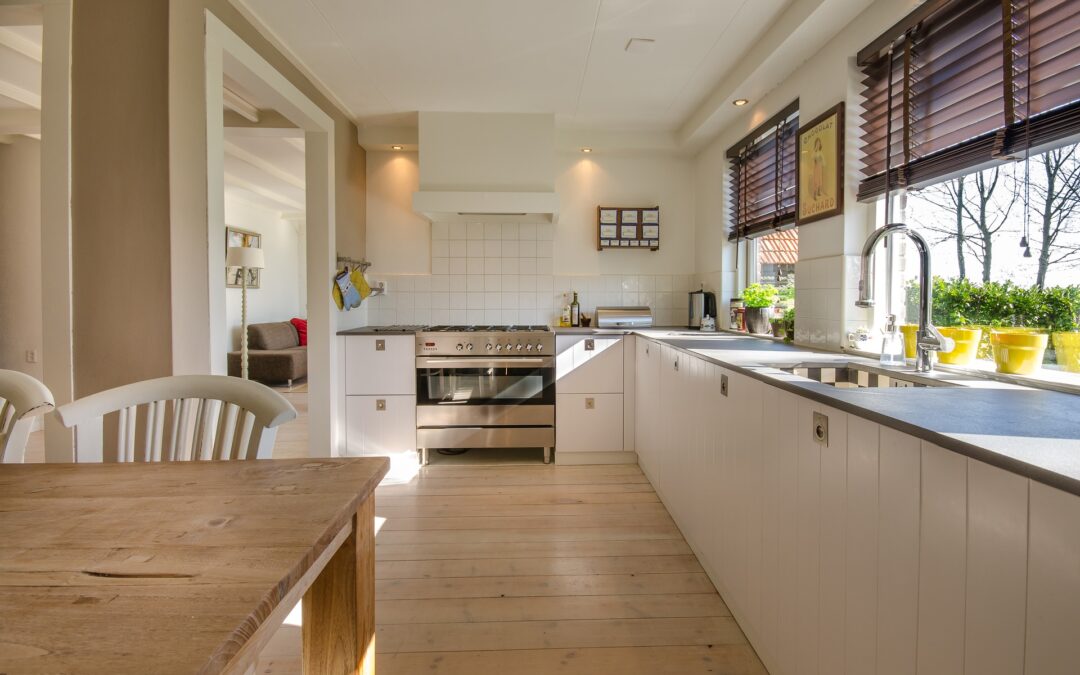 Kitchen with white cabinets and concrete countertops